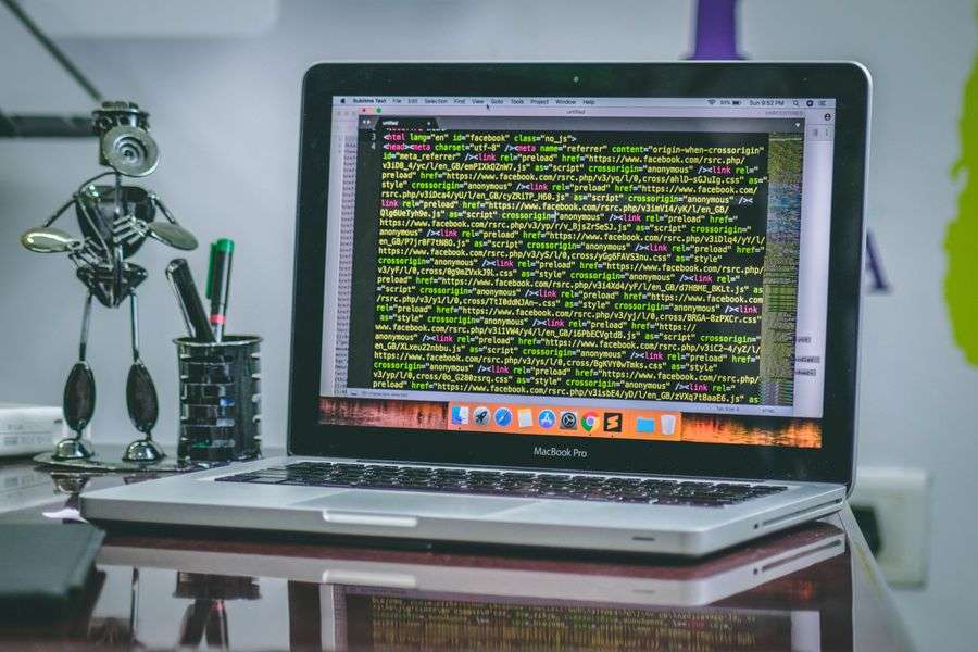 Developer MacBook with code