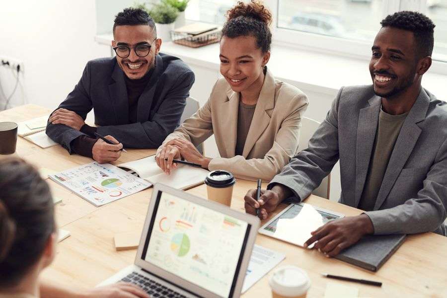 Startup founders working together on laptops