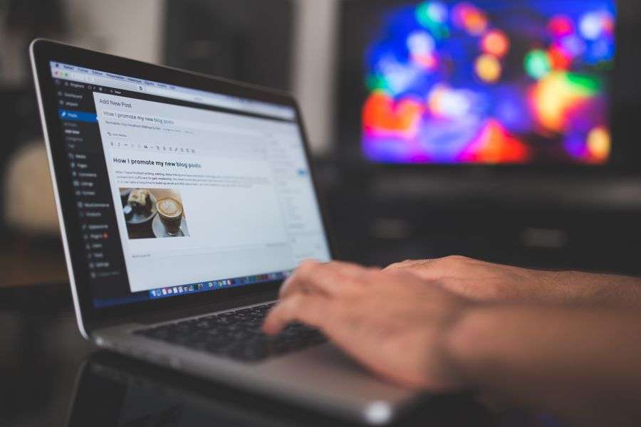 Typing on laptop